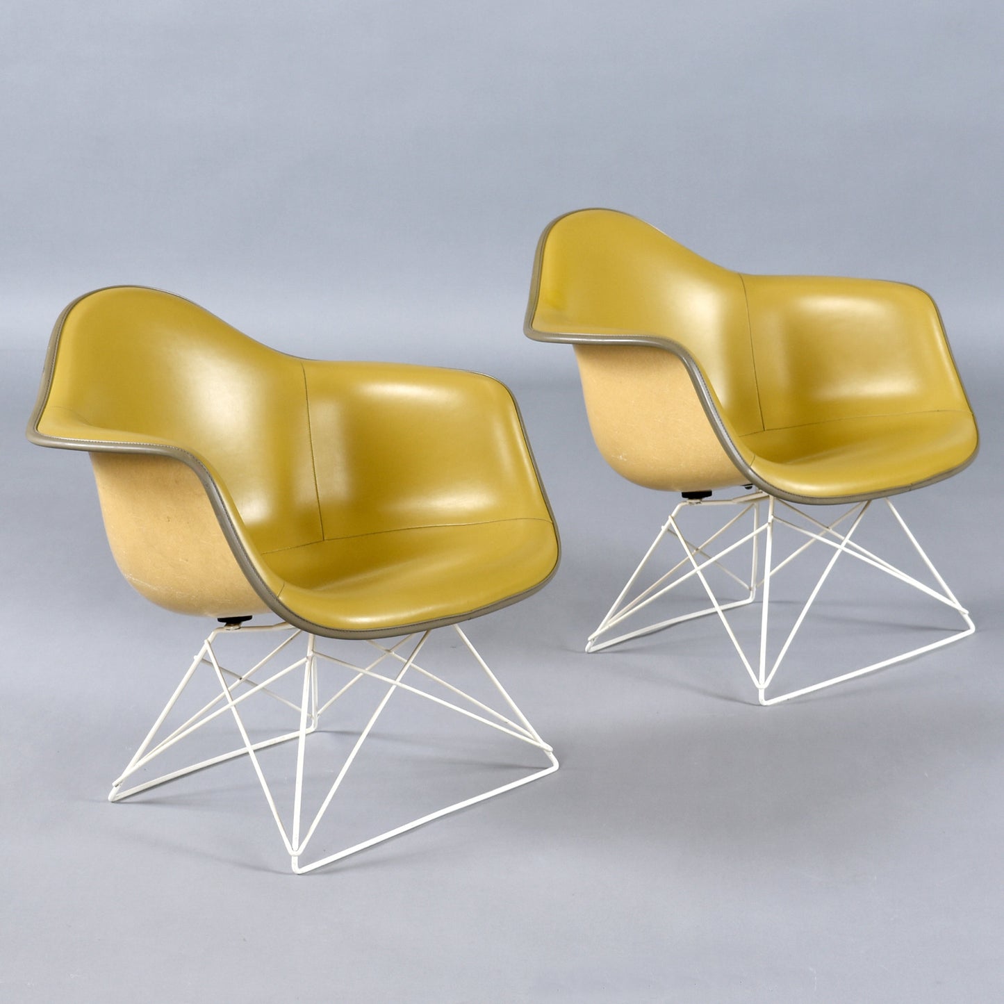 Pair of Eames for Herman Miller LAR Shell Chairs with Yellow Naugahyde Pads