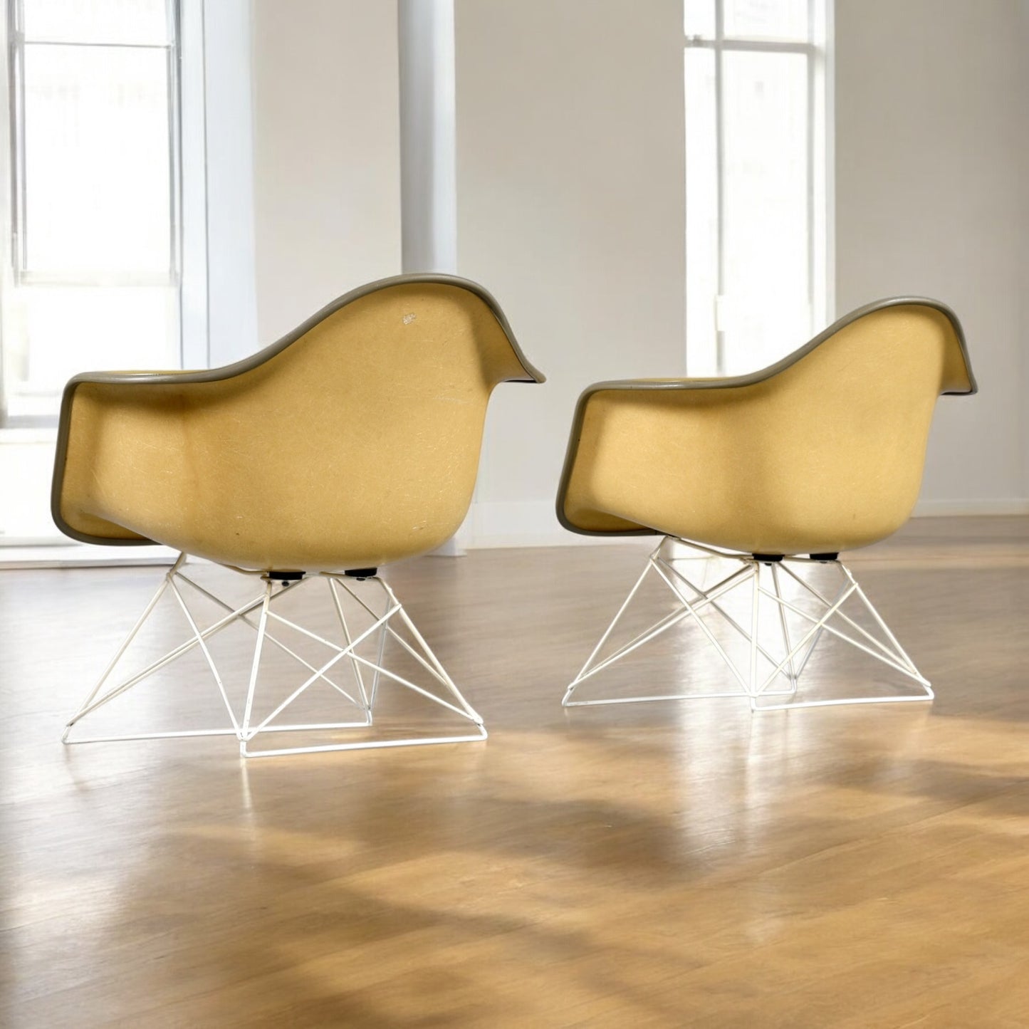 Pair of Eames for Herman Miller LAR Shell Chairs with Yellow Naugahyde Pads