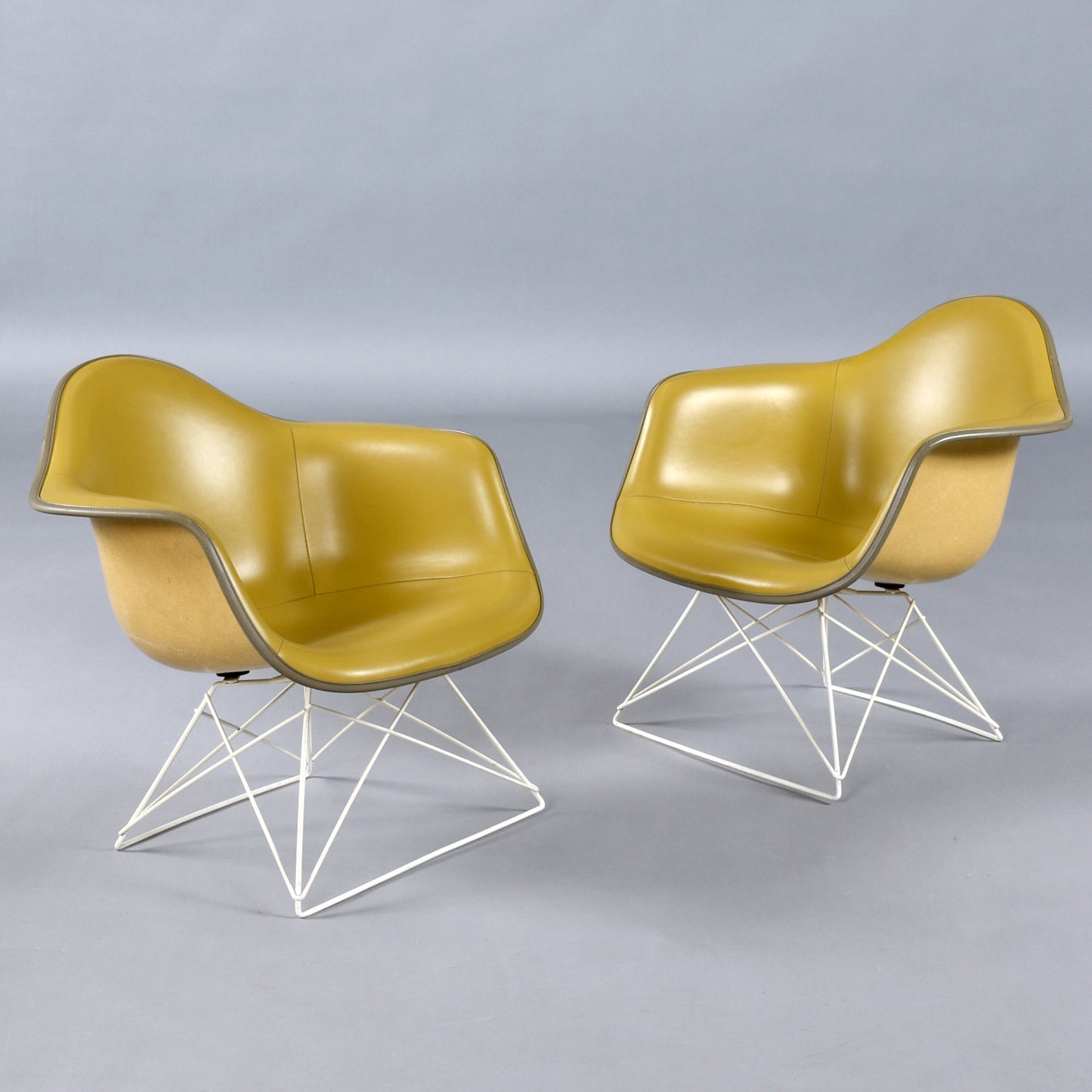Pair of Eames for Herman Miller LAR Shell Chairs with Yellow Naugahyde Pads