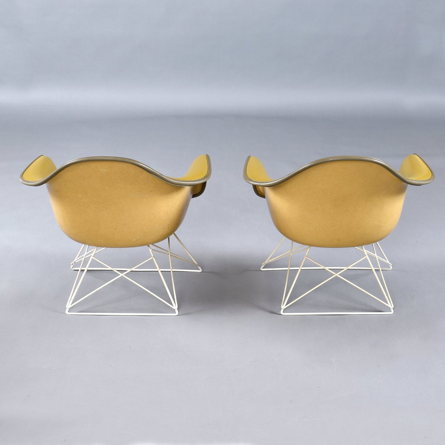 Pair of Eames for Herman Miller LAR Shell Chairs with Yellow Naugahyde Pads