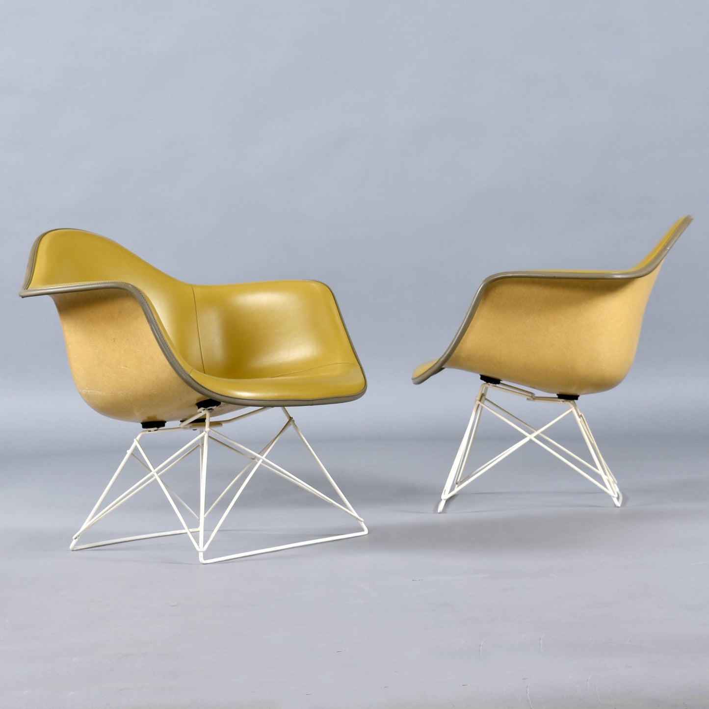 Pair of Eames for Herman Miller LAR Shell Chairs with Yellow Naugahyde Pads